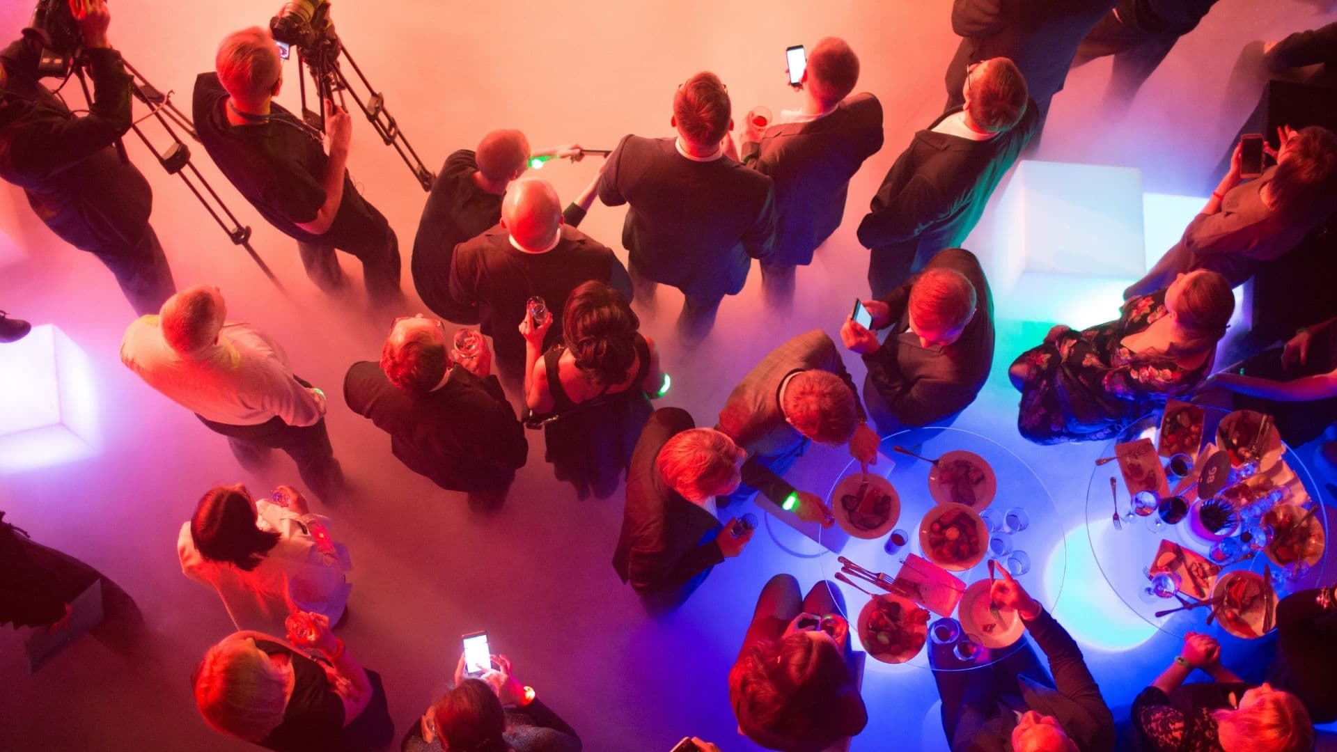 Downsteam hero image of event with cameras and mood lighting